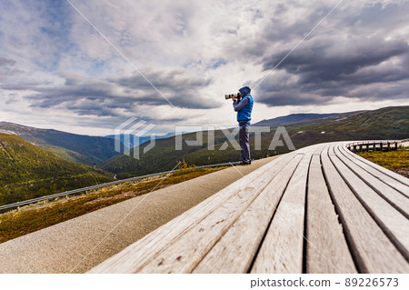 Woman on Vedahaugane rest stop, Norway 89226573