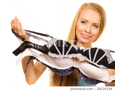 Woman choosing bra to wear Woman choosing bra to wear 89226584