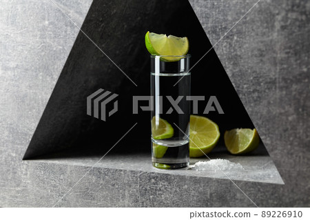 Tequila with lime slices and sea salt. 89226910