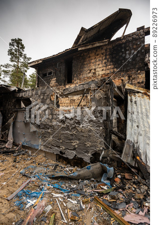 Hostomel, Kyev region Ukraine - 09.04.2022: Cities of Ukraine after the Russian occupation. Houses that burned down after being hit by rockets, mines. Irpin, Bucha, Gostomel. Hostomel, Kyev region Ukraine - 09.04.2022: Cities of Ukraine after the Russian occupation. Houses that burned down after being hit by rockets, mines. Irpin, Bucha, Gostomel. 89226973