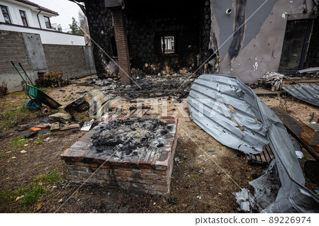 Hostomel, Kyev region  Ukraine - 09.04.2022: Cities of Ukraine after the Russian occupation. Houses that burned down after being hit by rockets, mines. Irpin, Bucha, Gostomel. 89226974