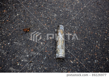 Hostomel, Kyev region Ukraine - 09.04.2022: Cities of Ukraine after the Russian occupation. Cartridge cases lie at the site of hostilities. Hostomel, Kyev region Ukraine - 09.04.2022: Cities of Ukraine after the Russian occupation. Cartridge cases lie at the site of hostilities. 89226977