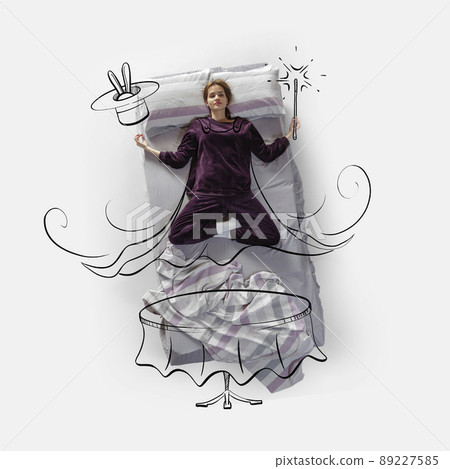 Creative image. Top view of young woman lying on bed, sleeping, dreaming about being magician 89227585
