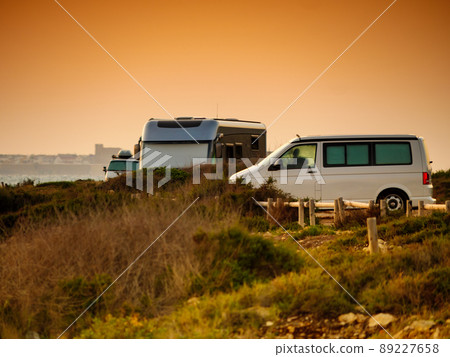 Camper cars on beach sea shore 89227658