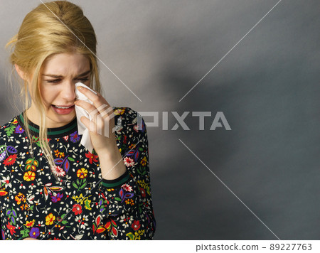 Young woman is crying Young woman is crying 89227763