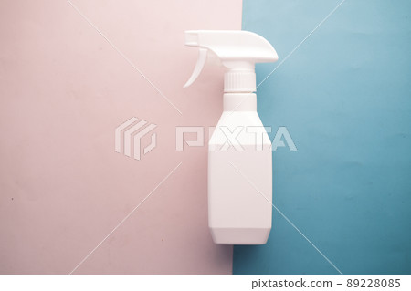top view of white color spray bottle on color background top view of white color spray bottle on color background 89228085