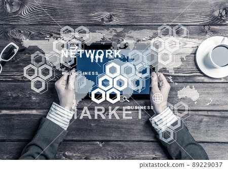 Business workplace with tablet device coffee cup and media user interface 89229037