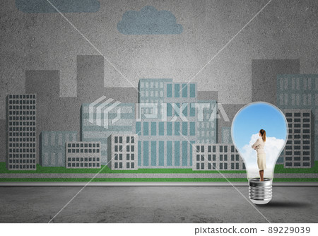 Businesswoman trapped in bulb Businesswoman trapped in bulb 89229039