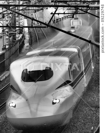 Shinkansen N700S J27 formation near Yamashina in the rain Shinkansen N700S J27 formation near Yamashina in the rain 89229748