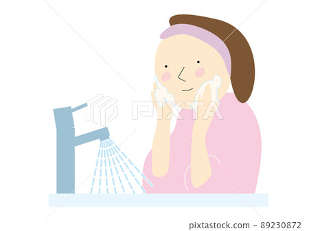 A woman washing her face A woman washing her face 89230872
