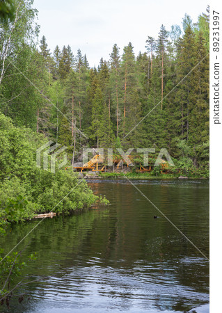 Karelian landscape with still lake in a forest 89231997