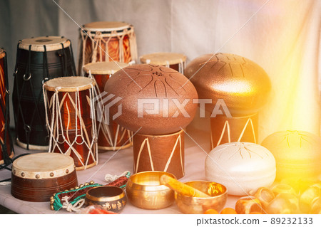 Steel Tongue Drum And Other Drums In Market store display shop. sunlight sunshine light 89232133