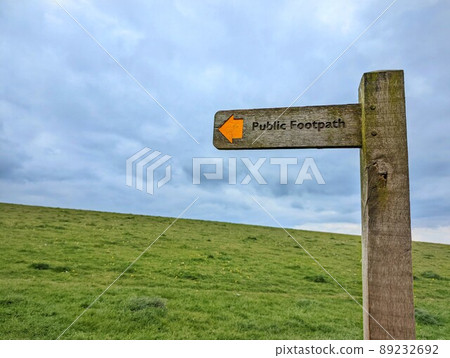Public footpath signpost pointing north in Sussex, England 89232692