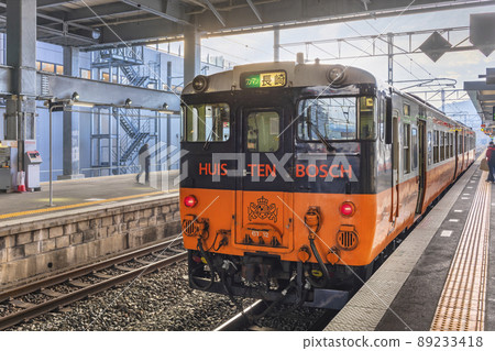 [Kyushu / Isahaya] Huis Ten Bosch Limited Express JNR Kiha 66 series train for Nagasaki that is stopped at the station. 89233418