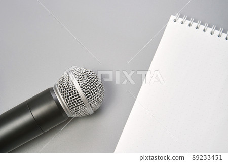 Podcast concept. Black microphone, content notebook, monstera leaf. Audio Podcast concept. Black microphone, content notebook, monstera leaf. Audio 89233451