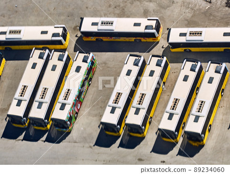 Aerial Birds Eye View Shot Of Bus Station Lined Up And Filled With Buses 89234060