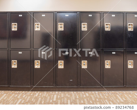 Close up shot of many black suitcase locks storage Close up shot of many black suitcase locks storage 89234768