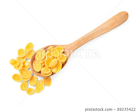 Wooden spoon of tasty corn flakes on white background, top view Wooden spoon of tasty corn flakes on white background, top view 89235422