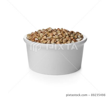 Organic green buckwheat in bowl isolated on white Organic green buckwheat in bowl isolated on white 89235498