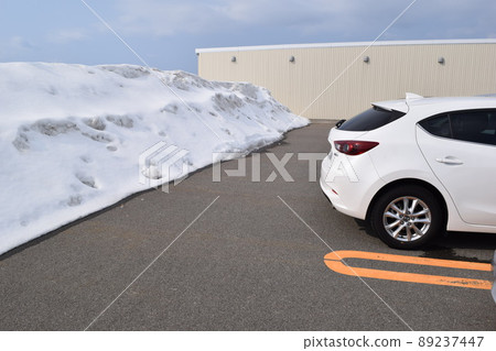 Parking lot in a snowy country where snow was removed Parking lot in a snowy country where snow was removed 89237447