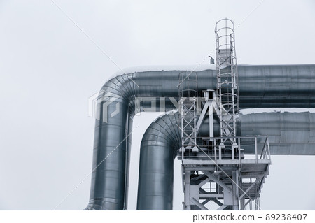 Isolated: Huge gas pipeline laid along snowy street in Riga, Latvia 89238407