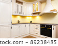 White empty kitchen with light white furniture - Warm lights and nicely decorated wood 89238485