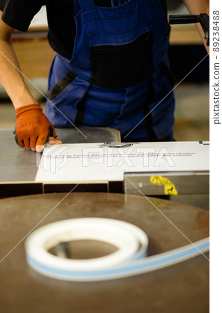 Woodwork and furniture making concept. A carpenter in the workshop doing joinery Woodwork and furniture making concept. A carpenter in the workshop doing joinery 89238488