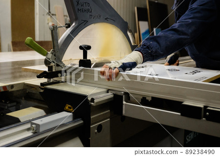 Woodwork and furniture making concept. A carpenter in the workshop doing joinery 89238490