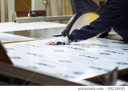 Woodwork and furniture making concept. A carpenter in the workshop doing joinery 89238495