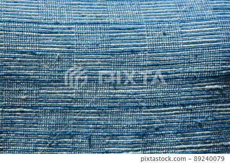 Close-up texture  indigo dyed fabric, dyed with natural plant indigo dye. 89240079