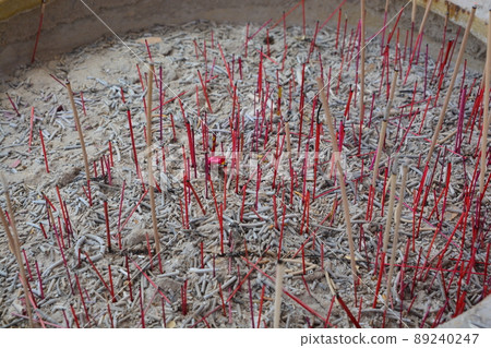 burning of red incense stick at chinese temple 89240247