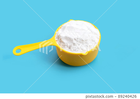 Baking soda on blue background. Baking soda on blue background. 89240426