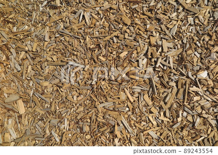 A landscape of wood chips spread all over the ground 12 A landscape of wood chips spread all over the ground 12 89243554