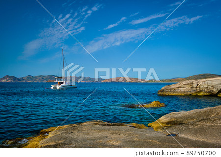 Yacht boat at Sarakiniko Beach in Aegean sea, Milos island , Greece 89250700