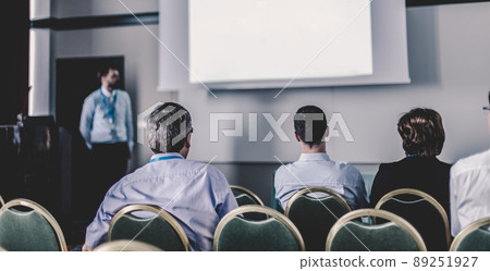 Audience in lecture hall participating at business conference. Audience in lecture hall participating at business conference. 89251927