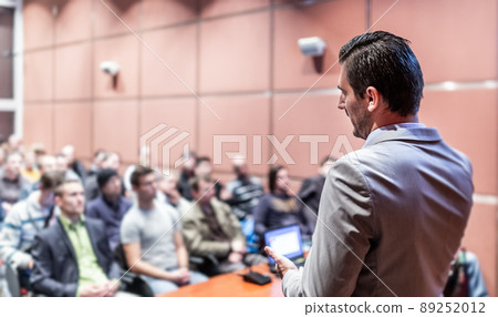 Public speaker giving talk at business event. Public speaker giving talk at business event. 89252012