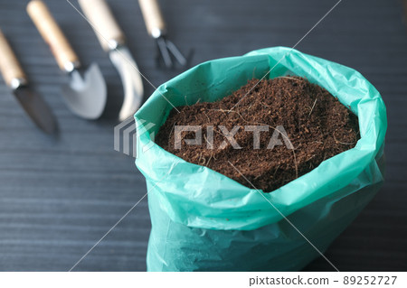coco peat and gardening tools a table with copy space  89252727