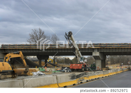 Restoration large road construction site in renovation bridge of a modern road interchange in USA Restoration large road construction site in renovation bridge of a modern road interchange in USA 89252971