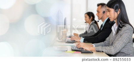 Business people wearing headset working in office broaden view Business people wearing headset working in office broaden view 89255033