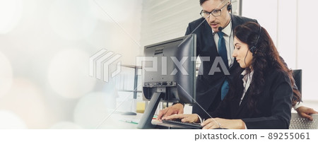 Business people wearing headset working in office broaden view Business people wearing headset working in office broaden view 89255061