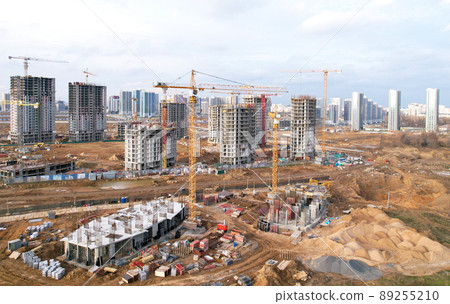 Construction site with tower cranes on formwork building construction.  89255210