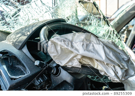 car after a car accident at a junkyard, airbag 89255309