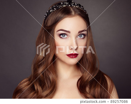 Fashion portrait of elegant woman with magnificent hair Fashion portrait of elegant woman with magnificent hair 89257086