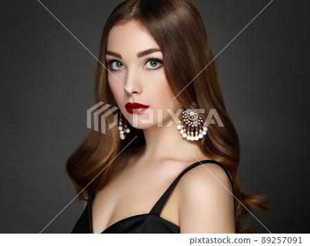 Fashion portrait of elegant woman with magnificent hair Fashion portrait of elegant woman with magnificent hair 89257091