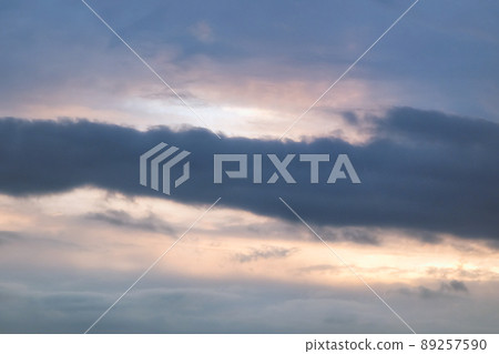 Beautiful dramatic evening sky in blue, yellow and orange colors. Sunset sky. Banner Beautiful dramatic evening sky in blue, yellow and orange colors. Sunset sky. Banner 89257590