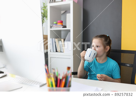 Little girl using laptop watch funny cartoons at home. Little girl using laptop watch funny cartoons at home. 89257832