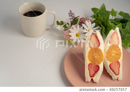 Strawberry and orange fruit sandwich and coffee 89257857