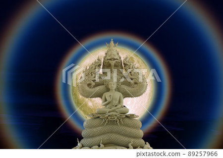 Moon corona light and Buddha protected by the hood of the mythical king naga on the night sky Moon corona light and Buddha protected by the hood of the mythical king naga on the night sky 89257966