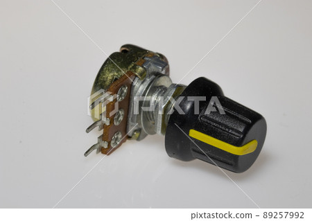 Potentiometer with knob on white background. Variable resistance. Electronic components. Potentiometer with knob on white background. Variable resistance. Electronic components. 89257992