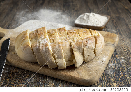 cut fresh bread into pieces while cooking with bread cut fresh bread into pieces while cooking with bread 89258333